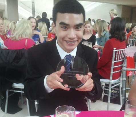 In my hands is the glass Spirit of Tom Landry Character Award, from Tiffany & Co.