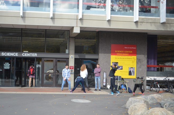 Students dancing in front of the Science Center
